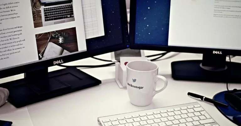 mug in front of a computer