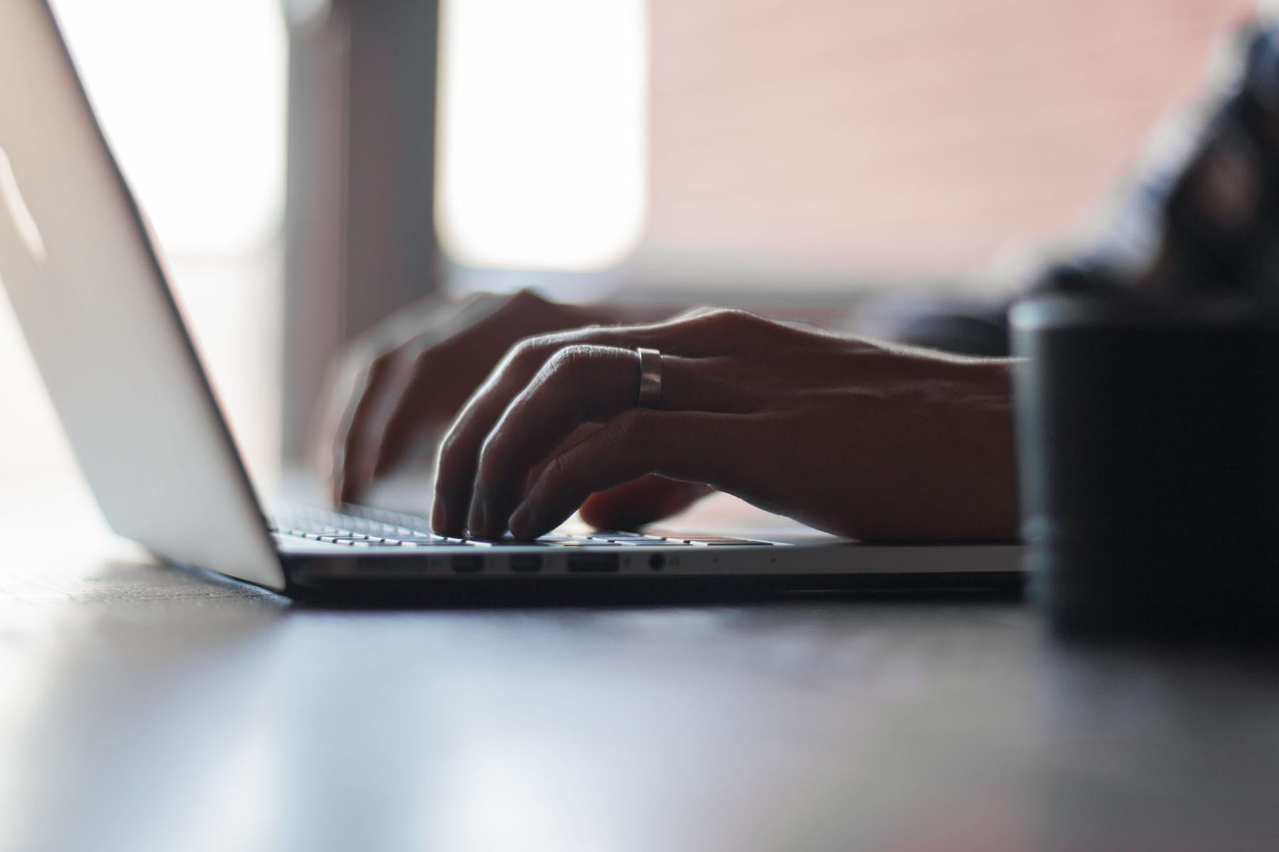 Hands typing on Laptop | PERQ Data Optimizes Property Websites