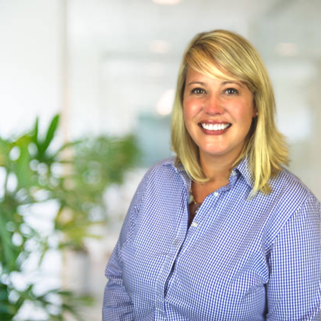 smiling picture of Kathryn in front of green plant | PERQ company